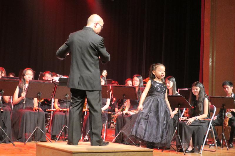 Three Hong Kong orchestras performed in Europe with the support of the Hong Kong Economic and Trade Office in Brussels to mark the 20th anniversary of the establishment of the Hong Kong Special Administrative Region. Photo shows the youngest member of the Hong Kong Festival Wind Orchestra performing solo at the concert in Barcelona, Spain on July 27 (Barcelona time).