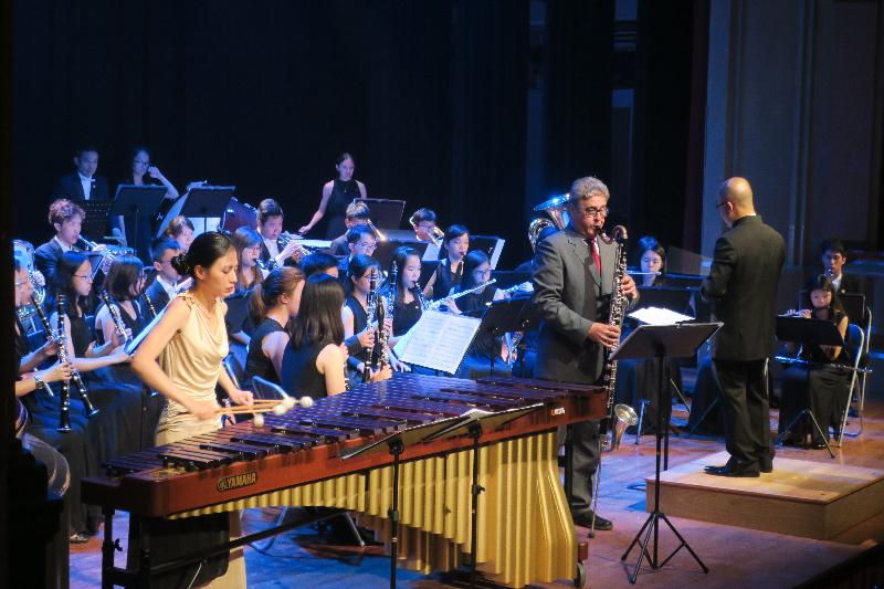 Three Hong Kong orchestras performed in Europe with the support of the Hong Kong Economic and Trade Office in Brussels to mark the 20th anniversary of the establishment of the Hong Kong Special Administrative Region. Photo shows Duo Antwerp, formed by Spanish bass clarinettist Dani Bellovi and Hong Kong percussionist Adilia Yip, performing with the Hong Kong Festival Wind Orchestra in Barcelona, Spain on July 27 (Barcelona time).