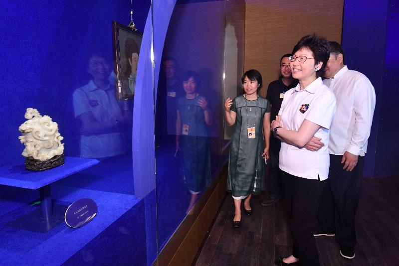 The Chief Executive, Mrs Carrie Lam (first right), tours the exhibition "Dialogue: The Forbidden City and the Maritime Silk Road" at the Palace Museum in Beijing this evening (August 6).
