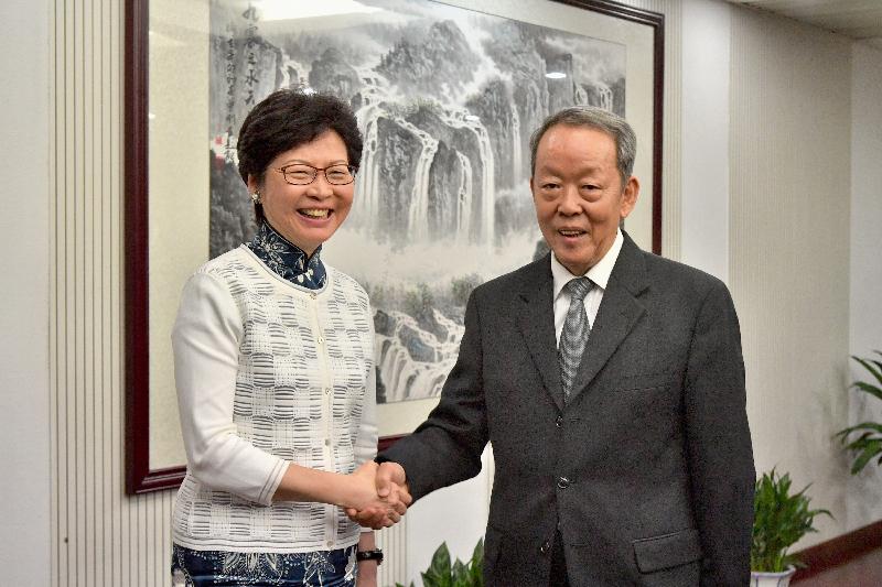 The Chief Executive, Mrs Carrie Lam (left), met the Director of the Hong Kong and Macao Affairs Office of the State Council, Mr Wang Guangya (right), in Beijing this afternoon (August 7). Mrs Lam is pictured shaking hands with Mr Wang before the meeting.