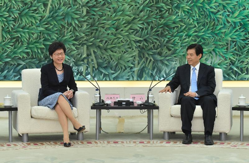 The Chief Executive, Mrs Carrie Lam (left), meets the Minister of Commerce, Mr Zhong Shan (right), in Beijing today (August 8).