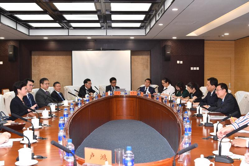 The Chief Executive, Mrs Carrie Lam (first left), meets the Minister of Culture, Mr Luo Shugang (first right), in Beijing this morning (August 9). Also joining the meeting is the Secretary for Commerce and Economic Development, Mr Edward Yau (second left). 