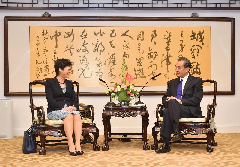 The Chief Executive, Mrs Carrie Lam (left), meets the Minister of Foreign Affairs, Mr Wang Yi (right), in Beijing this afternoon (August 9).