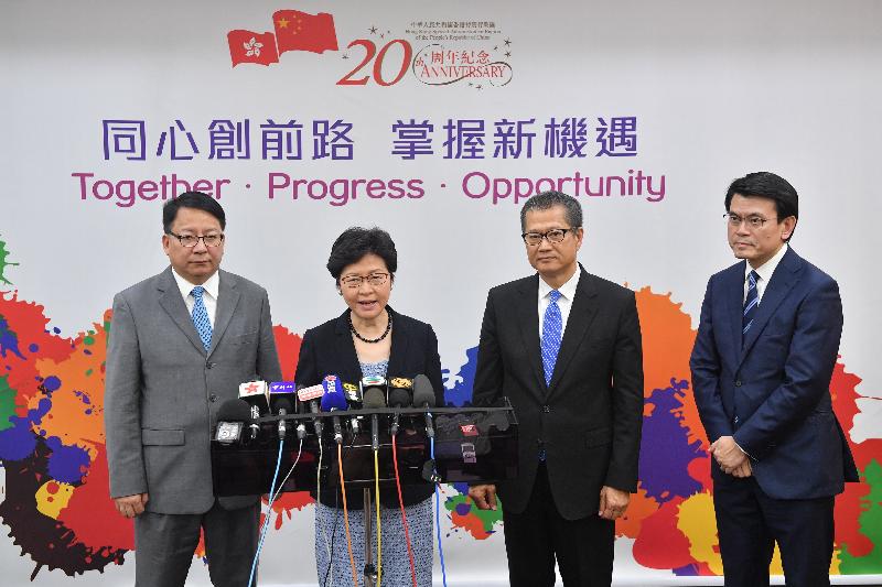 The Chief Executive, Mrs Carrie Lam (second left), meets the media this evening (August 9) to conclude her visit to Beijing. Also joining are the Financial Secretary, Mr Paul Chan (second right); the Secretary for Commerce and Economic Development, Mr Edward Yau (first right); and the Director of the Chief Executive's Office, Mr Chan Kwok-ki (first left).