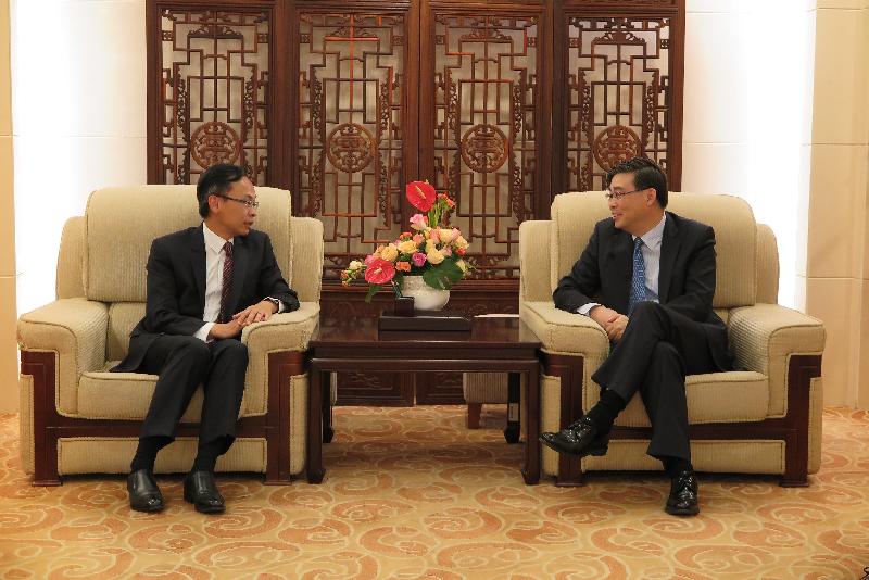 The Secretary for Constitutional and Mainland Affairs, Mr Patrick Nip (left), meets with the Director-General of the Department of Hong Kong, Macao and Taiwan Affairs of the Ministry of Foreign Affairs, Mr Feng Tie, in Beijing today (August 15).