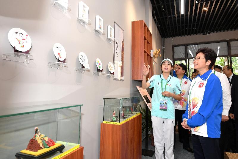 The Chief Executive, Mrs Carrie Lam, visited the Hong Kong athletes at the Athletes' Village today (August 27) before attending the opening ceremony of the 13th National Games in Tianjin. Photo shows Mrs Lam (right) touring the facilities in the village.