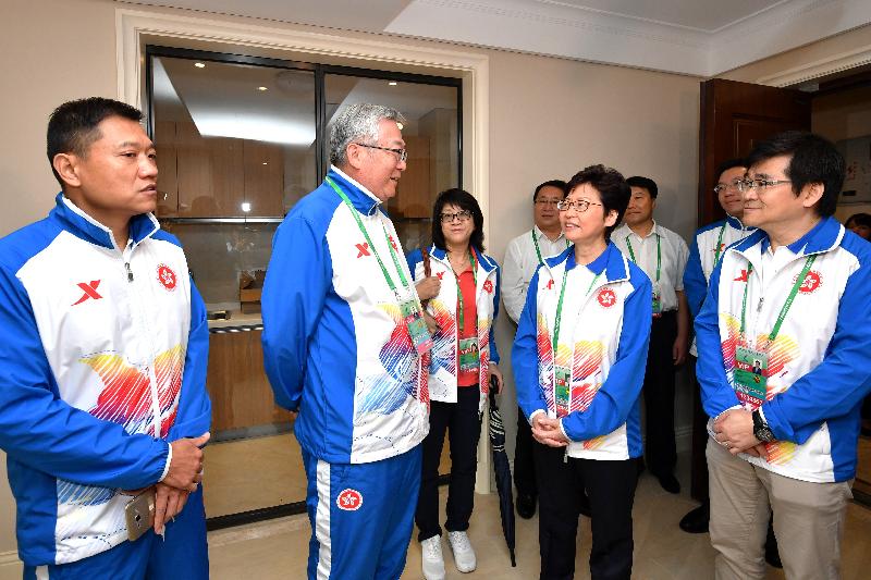 The Chief Executive, Mrs Carrie Lam, visited the Hong Kong athletes at the Athletes' Village today (August 27) before attending the opening ceremony of the 13th National Games in Tianjin. Photo shows Mrs Lam (second right)chatting with the leader and the coach from the Hand Ball Team.