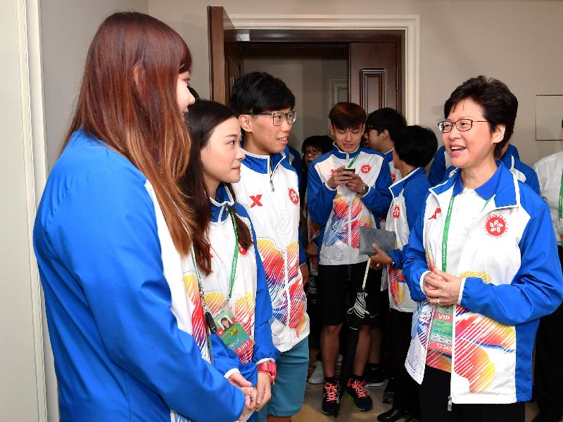 The Chief Executive, Mrs Carrie Lam, visited the Hong Kong athletes at the Athletes' Village today (August 27) before attending the opening ceremony of the 13th National Games in Tianjin. Photo shows Mrs Lam (first right) chatting with athletes from the Fencing Team.