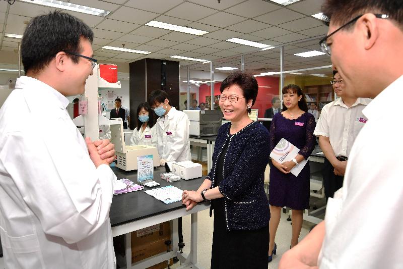 The Chief Executive, Mrs Carrie Lam, visited the Tianjin International Joint Academy of Biomedicine (TJAB) in Tianjin today (August 27). Photo shows Mrs Lam (centre) touring the laboratory in the TJAB.