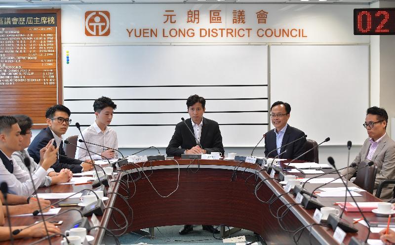 The Secretary for Constitutional and Mainland Affairs, Mr Patrick Nip, visited Yuen Long today (August 29) and met with members of the Yuen Long District Council (YLDC) to gain a better grasp of the district's developments and needs. Picture shows Mr Nip (second right) exchanging views with YLDC members in the company of the Chairman of the YLDC, Mr Shum Ho-kit (third right), and the District Officer (Yuen Long), Mr Edward Mak (first right).