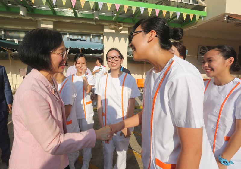 The Secretary for Food and Health, Professor Sophia Chan (left), chats with student nurses during her visit to Grantham Hospital today (August 29).