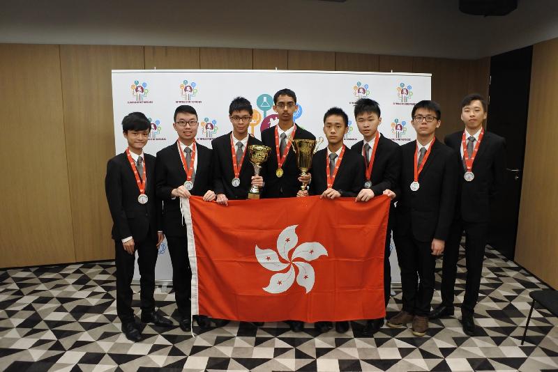 Members of the Hong Kong Team to the International Olympiad of Metropolises proudly display their medals and trophies. Pictured from left to right: Wong Tsz-chun, Chan Chak-fu, Wong Chi-fung, Rahul Arya, Li Shing-yan, Arvin Leung Yui-hin, Samuel Lee Shun-ming and Wong Yik-chun.  
