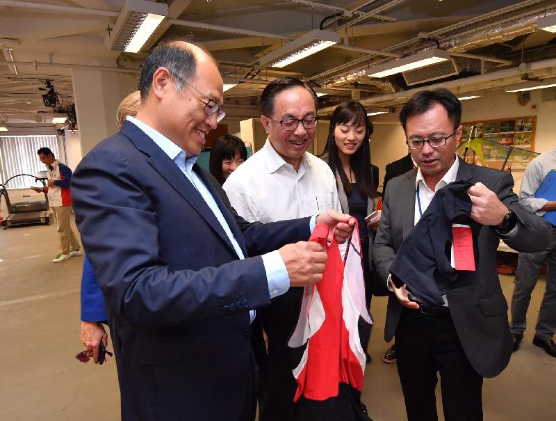 The Chairman of the Board of Directors of the Hong Kong Sports Institute (HKSI), Dr Lam Tai-fai (first left), and the Director of Elite Training Science and Technology, Dr Raymond So (first right), today (September 18) show the Secretary for Innovation and Technology, Mr Nicholas W Yang (second left), the high-performance sportswear developed by the HKSI and the Hong Kong Research Institute of Textiles and Apparel for the Hong Kong rowing team.