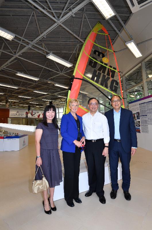 The Secretary for Innovation and Technology, Mr Nicholas W Yang (second right), joins a group photo with the Chairman of the Board of Directors of the Hong Kong Sports Institute (HKSI), Dr Lam Tai-fai (first right); the Chief Executive of the HKSI, Dr Trisha Leahy (second left); and the District Officer (Sha Tin), Miss Amy Chan (first left), in front of the windsurfing board which Ms Lee Lai-shan, the first-ever Olympic gold medalist of Hong Kong, used at the 1996 Atlanta Olympics during his visit to the HKSI today (September 18).