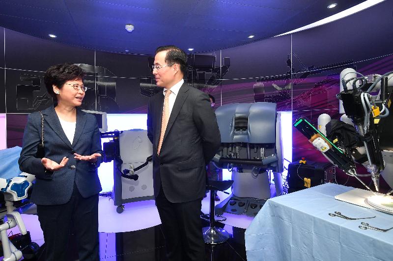 The Chief Executive, Mrs Carrie Lam (left), visits the Hamlyn Centre of the Imperial College London today (September 22, London time).