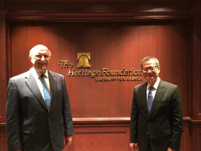 The Financial Secretary, Mr Paul Chan (right), had a breakfast meeting with the Director of the Center for Data Analysis and the Center for Trade and Economics of the Heritage Foundation, Mr Terry Miller (left) in Washington, DC, on October 13 (Washington time).