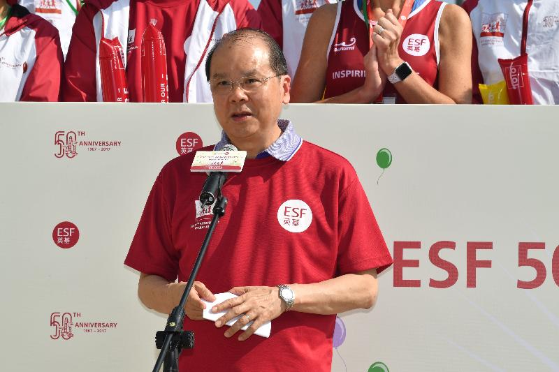 The Chief Secretary for Administration, Mr Matthew Cheung Kin-chung, speaks at the ESF 50th Anniversary Marathon today (October 22).
