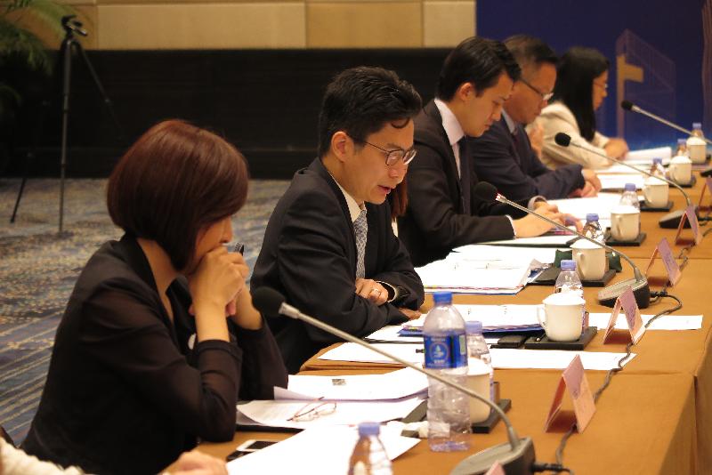 The Under Secretary for Financial Services and the Treasury, Mr Joseph Chan (second left), speaks at the meeting of the Expert Group on Hong Kong-Guangdong Financial Co-operation today (October 25).
