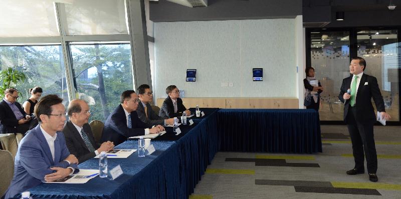 The Chief Secretary for Administration, Mr Matthew Cheung Kin-chung (second left), and the Secretary for Innovation and Technology, Mr Nicholas W Yang (third left), are briefed by the Chairman of the Board of Directors of Hong Kong Cyberport Management Company Limited, Dr George Lam (first right), on the financial and professional support provided to start-ups at different stages of their development today (October 26). Also present is the Chairman of the Southern District Council, Mr Chu Ching-hong (first left).