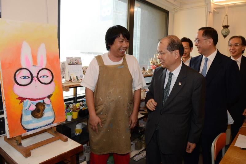 The Chief Secretary for Administration, Mr Matthew Cheung Kin-chung (second left), and the Secretary for Innovation and Technology, Mr Nicholas W Yang (third left), visit a studio of local artists at ADC Artspace in Wong Chuk Hang to be updated on the development of the local arts sector today (October 26). 