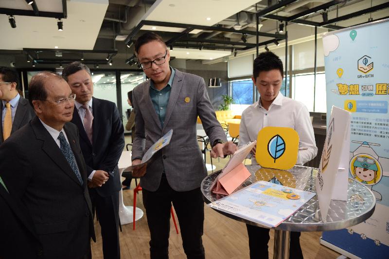 The Chief Secretary for Administration, Mr Matthew Cheung Kin-chung (first left), visits Cyberport and is briefed on the financial and professional support provided to start-ups at different stages of their development today (October 26). Also present is the Chief Executive Officer of Hong Kong Cyberport Management Company Limited, Mr Herman Lam (second left).