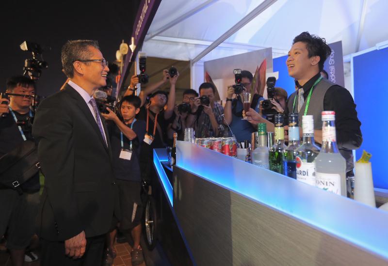 The Financial Secretary, Mr Paul Chan (left), tours the 2017 Hong Kong Wine & Dine Festival at the Central Harbourfront Event Space this evening (October 26).