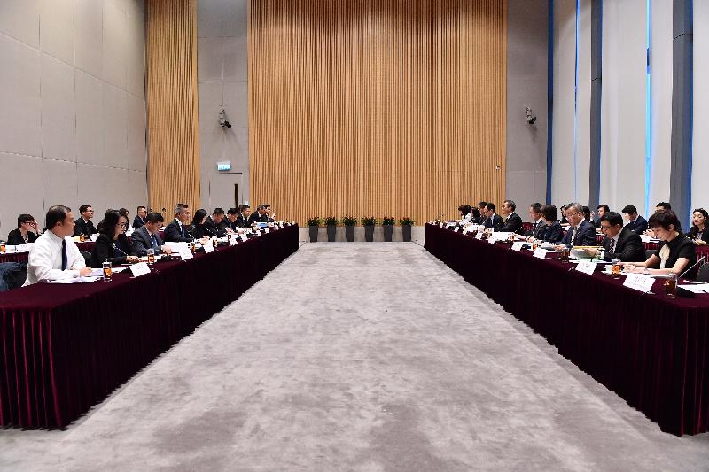The Financial Secretary, Mr Paul Chan (sixth right), and the Secretary for Economy and Finance of the Macao Special Administrative Region, Mr Lionel Leong (sixth left), co-chair the 10th Hong Kong Macao Co-operation High Level Meeting in Hong Kong today (October 27).