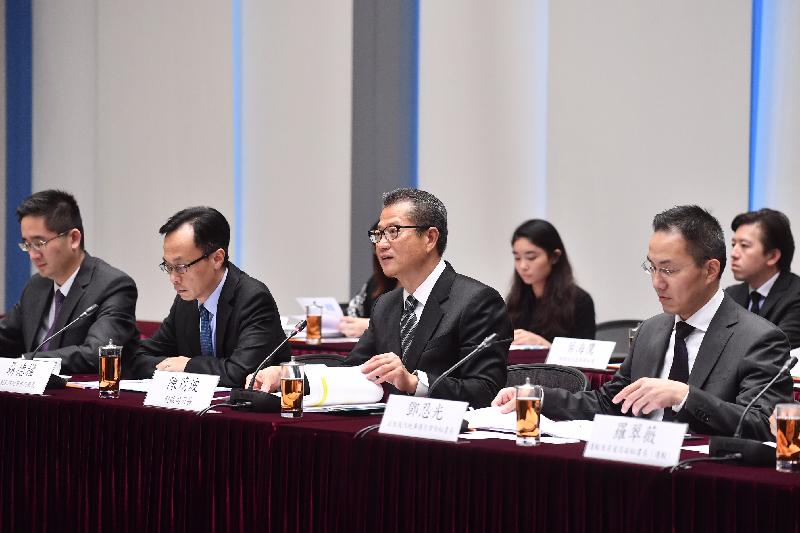 The Financial Secretary, Mr Paul Chan (second right), addresses the 10th Hong Kong Macao Co-operation High Level Meeting in Hong Kong today (October 27).