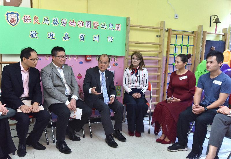 The Chief Secretary for Administration, Mr Matthew Cheung Kin-chung (third left), visits Po Leung Kuk Kwai Fong Kindergarten-cum-Nursery and is briefed by the school's representatives on its future development plan today (October 30). Also present are the District Officer (Kwai Tsing), Mr Alan Lo (first left); the Chairman of the Kwai Tsing District Council, Mr Law King-shing (second left); and the Chairman of Po Leung Kuk, Miss Abbie Chan (third right).