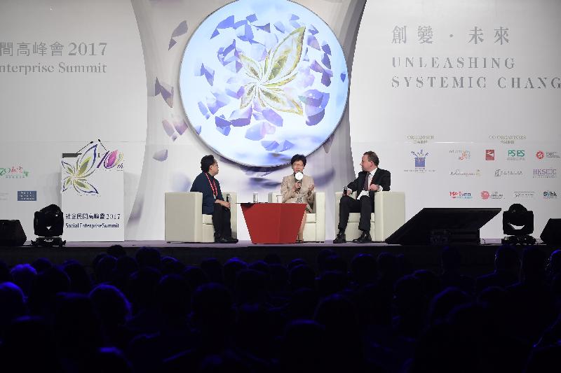 The Chief Executive, Mrs Carrie Lam, attended the opening ceremony of the Social Enterprise Summit 2017 this afternoon (November 7). Photo shows Mrs Lam (centre) and the Chief Executive of the National Endowment for Science, Technology and the Arts of the United Kingdom, Mr Geoff Mulgan (right), conducting the policy dialogue on "Public Innovation and Collective Intelligence for Our City". Looking on is the facilitator, the Deputy Chair of Social Enterprise Summit, Ms Ada Wong (left).