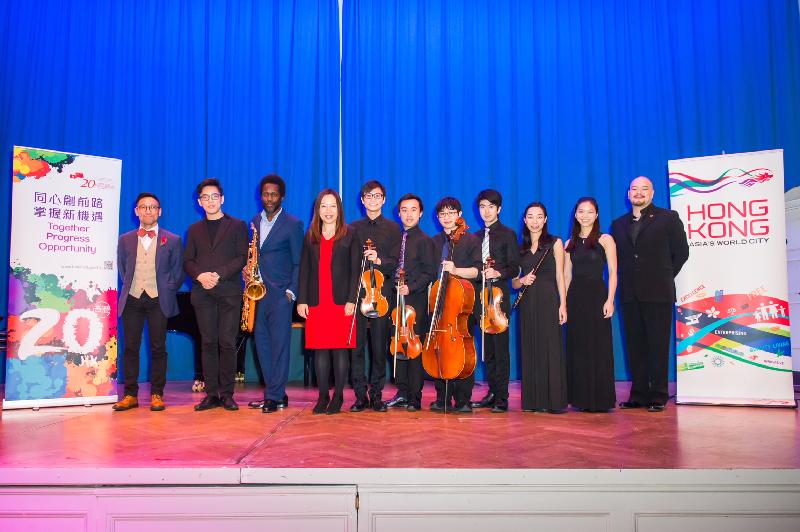 The Hong Kong Economic and Trade Office, London (London ETO) organised a music concert, "Resounding Bauhinia", at the Bishopsgate Institute in London on November 9 (London time). Photo shows the Director-General of the London ETO, Ms Priscilla To (fourth left), with the concert curator Mr Raymond Yiu (first left) and the musicians featured in the concert.