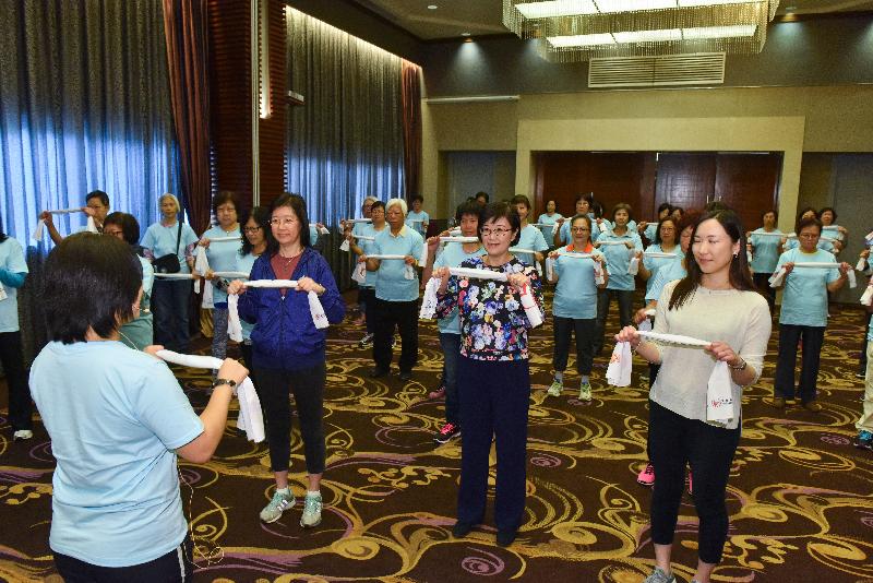 The Director of Health, Dr Constance Chan (front row, second right), takes part in a family workout exercise led by a nurse at the publicity and educational event tied in with World Diabetes Day today (November 14).