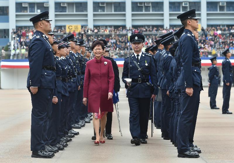 The Chief Executive, Mrs Carrie Lam, inspects 40 probationary inspectors and 176 recruit constables at the passing-out parade.