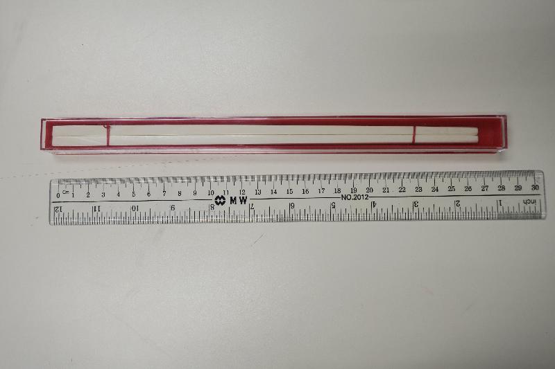The Agriculture, Fisheries and Conservation Department today (November 27) issued summonses against the proprietors of two shops for illegal possession of post-ban ivory for commercial purposes. Photo shows one of the pairs of ivory chopsticks which were found in radiocarbon dating analysis to be made of ivory obtained after the prohibition of international trade in ivory in 1990.