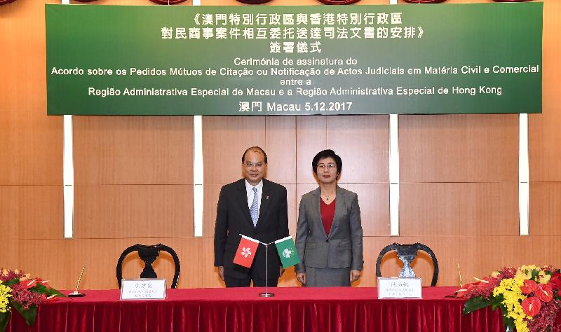 The Chief Secretary for Administration, Mr Matthew Cheung Kin-chung, today (December 5) attended the Signing Ceremony of the Arrangement for Mutual Service of Judicial Documents between the Hong Kong Special Administrative Region and the Macao Special Administrative Region at the Macao Government Headquarters. Mr Cheung (left) is pictured with the Secretary for Administration and Justice of the Macao Special Administrative Region, Ms Sonia Chan Hoi-fan, at the ceremony. 