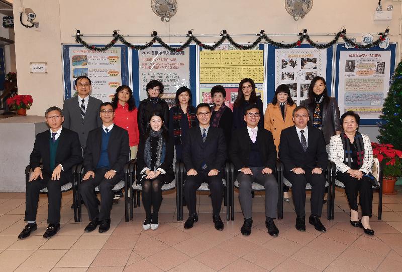 The Secretary for Education, Mr Kevin Yeung (front row, centre), visits Wong Tai Sin District today (December 9). Accompanied by the District Officer (Wong Tai Sin), Ms Annie Kong (front row, third left), Mr Yeung first went to Sheng Kung Hui St Benedict's School and met with the Chairman of Wong Tai Sin School Liaison Committee, Mr Mok Chung-fai (front row, third right); the Vice-Chairman, Mr Lo Fat-keung (front row, second left); and other members to exchange views on school development and other education issues.