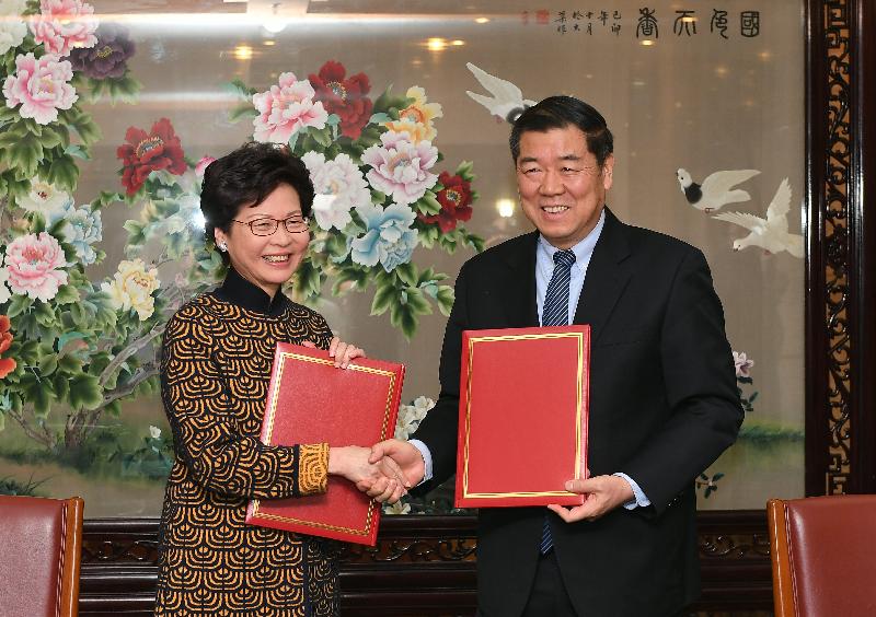 The Chief Executive, Mrs Carrie Lam, attended the signing ceremony of the Arrangement between National Development and Reform Commission and Hong Kong Special Administrative Region Government for Advancing Hong Kong's Full Participation in and Contribution to Belt and Road Initiative in Beijing this morning (December 14). Mrs Lam (left) is pictured with the Chairman of the National Development and Reform Commission, Mr He Lifeng (right), after signing the Arrangement.