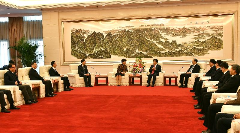 The Chief Executive, Mrs Carrie Lam (fifth left), meets the Minister of Public Security, Mr Zhao Kezhi (sixth right), in Beijing this afternoon (December 14). Also joining the meeting are the Secretary for Security, Mr John Lee (fourth left); the Secretary for Constitutional and Mainland Affairs, Mr Patrick Nip (third left); the Director of the Chief Executive's Office, Mr Chan Kwok-ki (first left); and the Commissioner of Police, Mr Lo Wai-chung (second left).