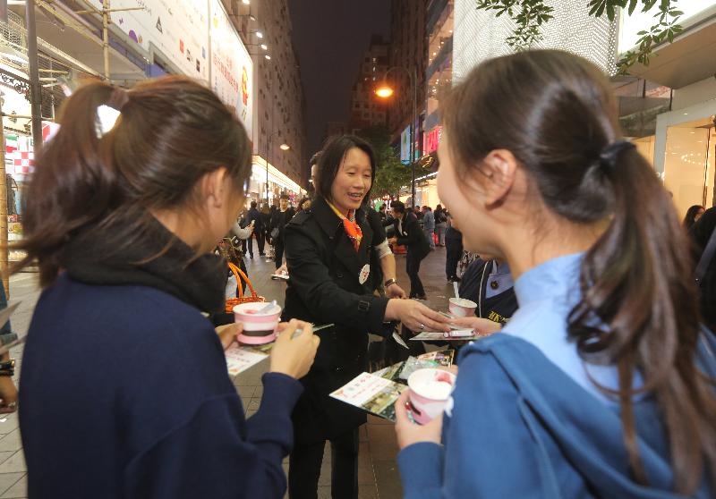 The Commissioner for Narcotics, Ms Manda Chan (centre), distributes leaflets and souvenirs to members of the public at an anti-drug publicity event at Paterson Street Pedestrian Precinct in Causeway Bay today (December 15) to remind them to stand firm against drug temptation while enjoying the seasonal festivities.