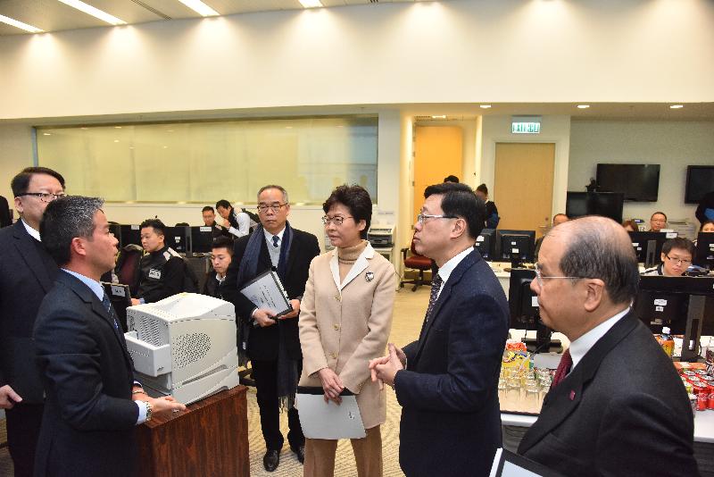 The Chief Executive, Mrs Carrie Lam (third right), and the Chief Secretary for Administration, Mr Matthew Cheung Kin-chung (first right), accompanied by the Secretary for Security, Mr John Lee (second right), inspect the operation of the Emergency Monitoring and Support Centre during the exercise "Checkerboard II" today (December 20).
