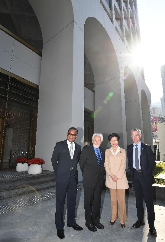 The Chief Executive, Mrs Carrie Lam, attended the completion ceremony of The Murray today (December 20). Photo shows Mrs Lam (second right); the Murrary Building's original architect, Mr Ron Philips (second left); and other guests in front of the hotel.