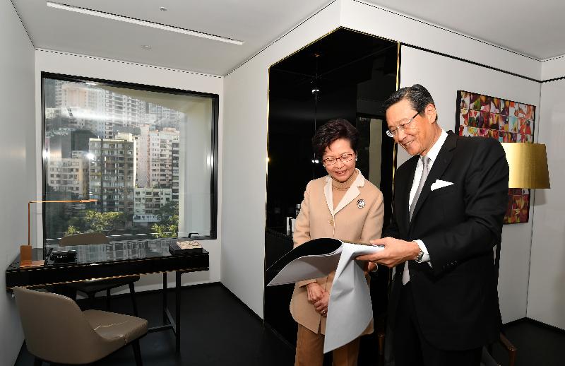 The Chief Executive, Mrs Carrie Lam, attended the completion ceremony of The Murray today (December 20). Photo shows Mrs Lam (left) touring the hotel accompanied by the Chairman of Wheelock Holdings PTE Limited, Mr Peter Woo (right).