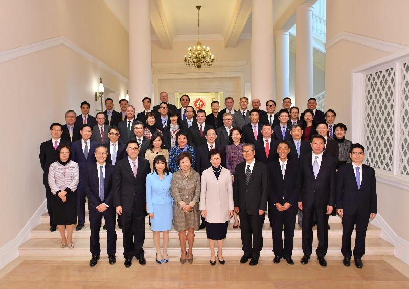 The Chief Executive, Mrs Carrie Lam (first row, centre); the Financial Secretary, Mr Paul Chan (first row, fourth right); the Chairman of the Financial Services Development Council (FSDC), Mrs Laura M Cha (first row, fourth left); and members of the FSDC are pictured at Government House today (January 5).