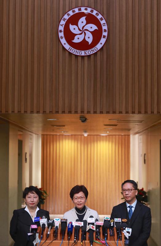 The Chief Executive, Mrs Carrie Lam (centre); the Secretary for Justice, Mr Rimsky Yuen, SC (right); and the Secretary for Justice (designate), Ms Teresa Cheng, SC (left), meet the media this morning (January 5).