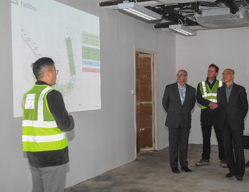 The Secretary for the Environment, Mr Wong Kam-sing (first right), today (January 8) visits the Jockey Club Hong Kong Football Association Football Training Centre, which is under construction at the restored Tseung Kwan O Stage I Landfill.
