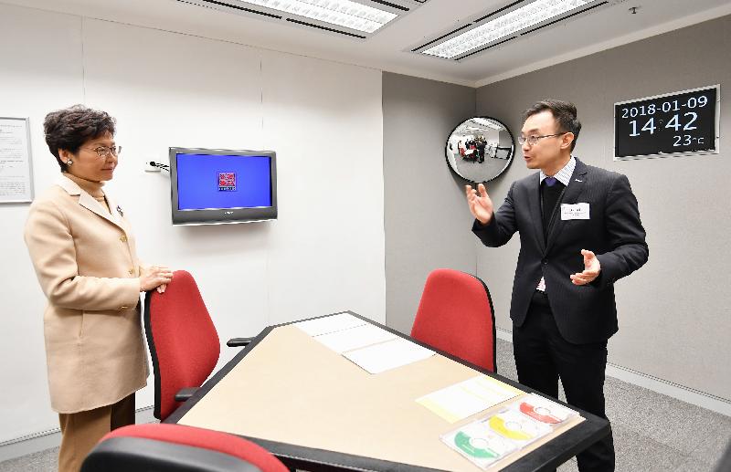 The Chief Executive, Mrs Carrie Lam (left), tours the video interview room at the ICAC Headquarters today (January 9).
