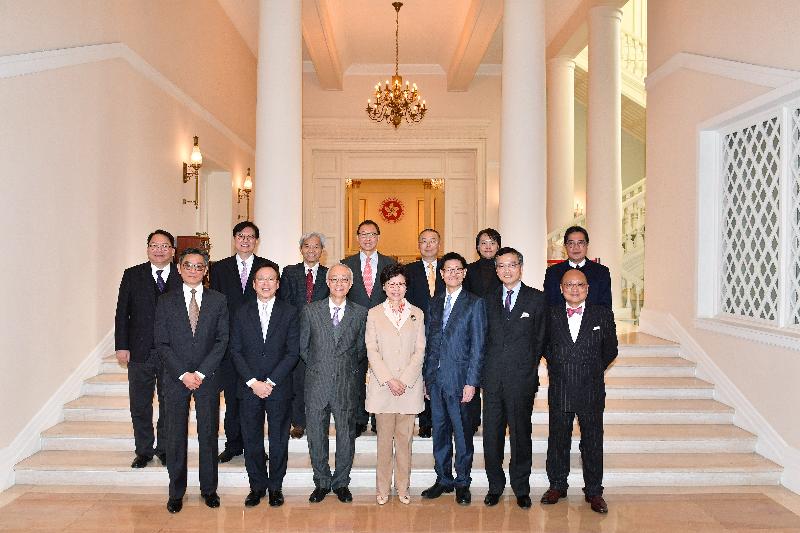The Chief Executive, Mrs Carrie Lam (front row, centre); the Secretary for Development, Mr Michael Wong (back row, first right); the Chairman of the Hong Kong Housing Society (HKHS), Mr Marco Wu (front row, third left); and Executive Committee members of the HKHS are pictured at Government House today (January 16).