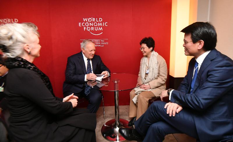 The Chief Executive, Mrs Carrie Lam, today (January 25, Davos time) continued to attend the World Economic Forum Annual Meeting in Davos, Switzerland. Photo shows Mrs Lam (second right), accompanied by the Secretary for Commerce and Economic Development, Mr Edward Yau (first right), holding a bilateral meeting in the morning with the Federal Councillor and Head of the Federal Department of Economic Affairs, Education and Research of Switzerland, Mr Johann Schneider-Ammann (second left).
