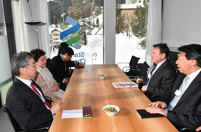 The Chief Executive, Mrs Carrie Lam, today (January 25, Davos time) continued to attend the World Economic Forum Annual Meeting in Davos, Switzerland. Photo shows Mrs Lam (second left), accompanied by the Secretary for Financial Services and the Treasury, Mr James Lau (first left), meeting in the morning with the Chairman of Standard Chartered Group, Mr José Viñals (second right), and the Regional Chief Executive Officer, Greater China & North Asia, Standard Chartered Bank (Hong Kong) Limited, Mr Benjamin Hung (first right). 
