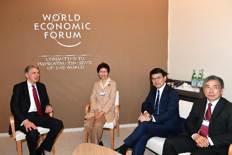 The Chief Executive, Mrs Carrie Lam, today (January 25, Davos time) continued to attend the World Economic Forum Annual Meeting in Davos, Switzerland. Photo shows Mrs Lam (second left), accompanied by the Secretary for Commerce and Economic Development, Mr Edward Yau (second right), and the Secretary for Financial Services and the Treasury, Mr James Lau (first right), in the afternoon meeting with the Chancellor of the Exchequer of the United Kingdom, Mr Philip Hammond (first left).